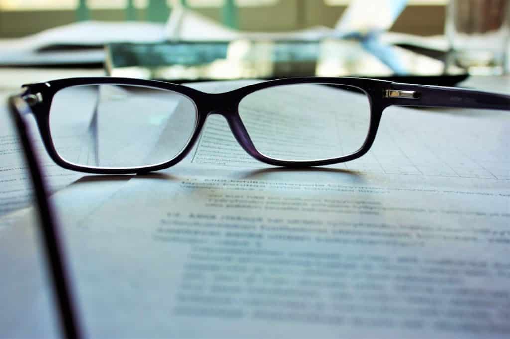 glasses on a pile of document