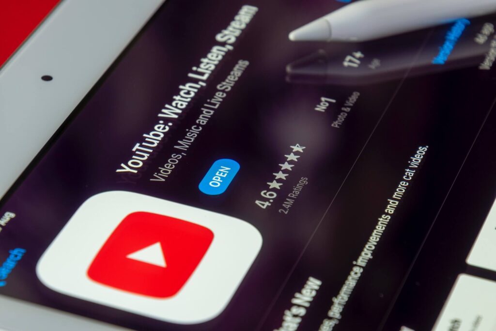 A close up of the YouTube app menu screen, including the YouTube logo of a red rectangle with a white triangle inside.