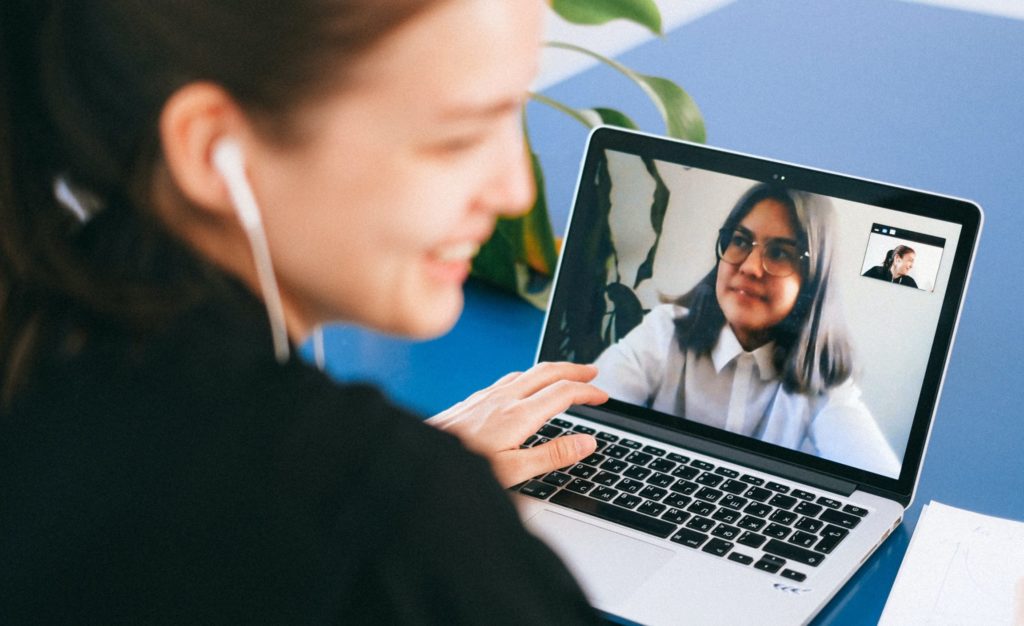 A woman having zoom meeting on her laptop