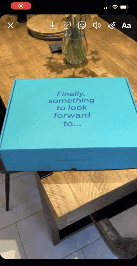 an Instagram story of a blue box on the table with caption