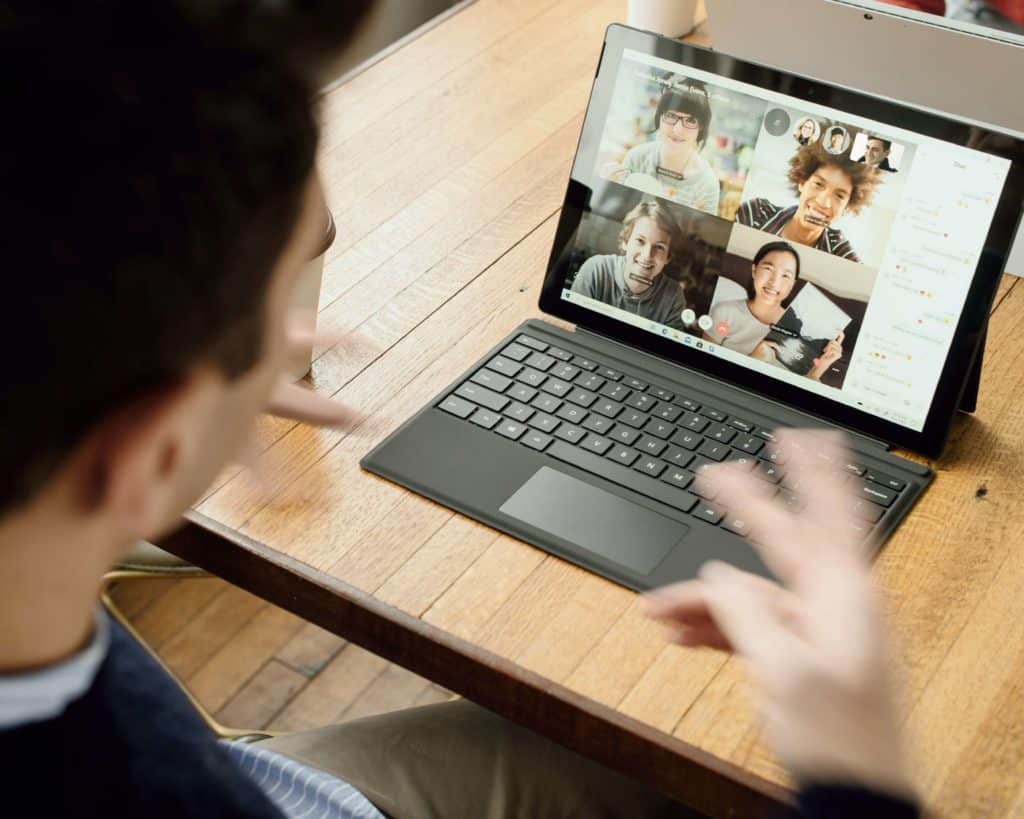 Person in a video call on a laptop