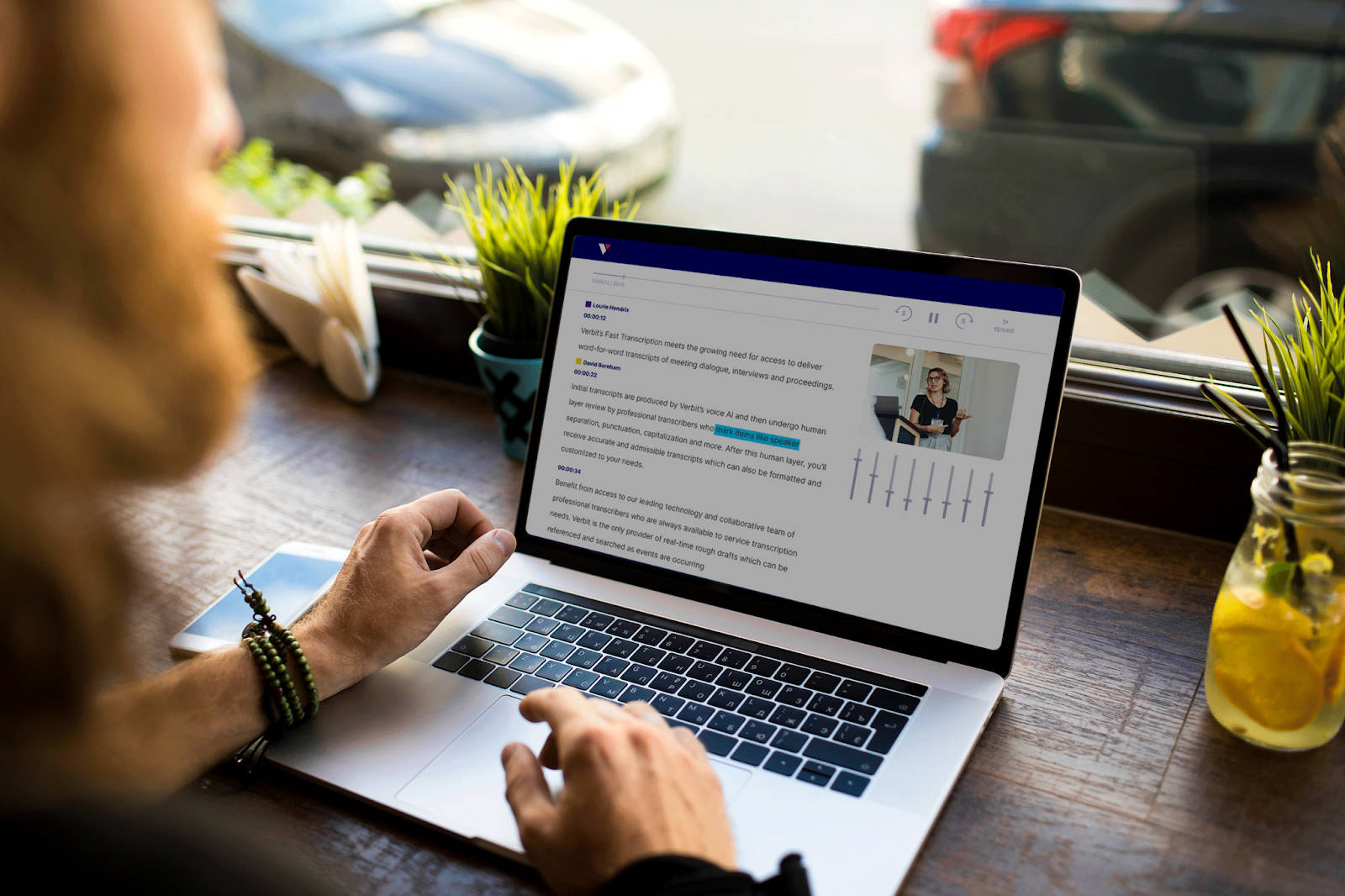 laptop on a table displaying an article being worked on by someone