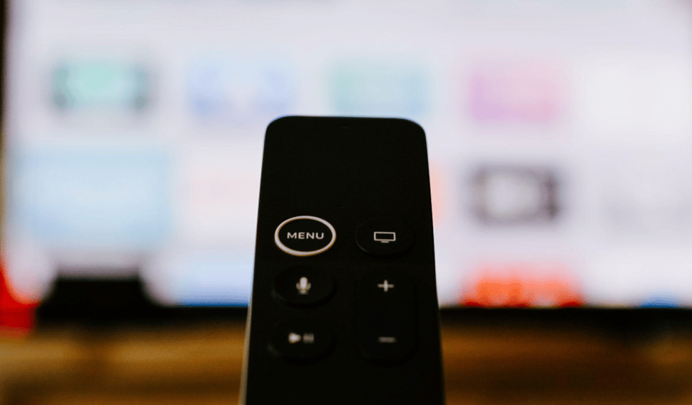 black remote pointed to a monitor or TV