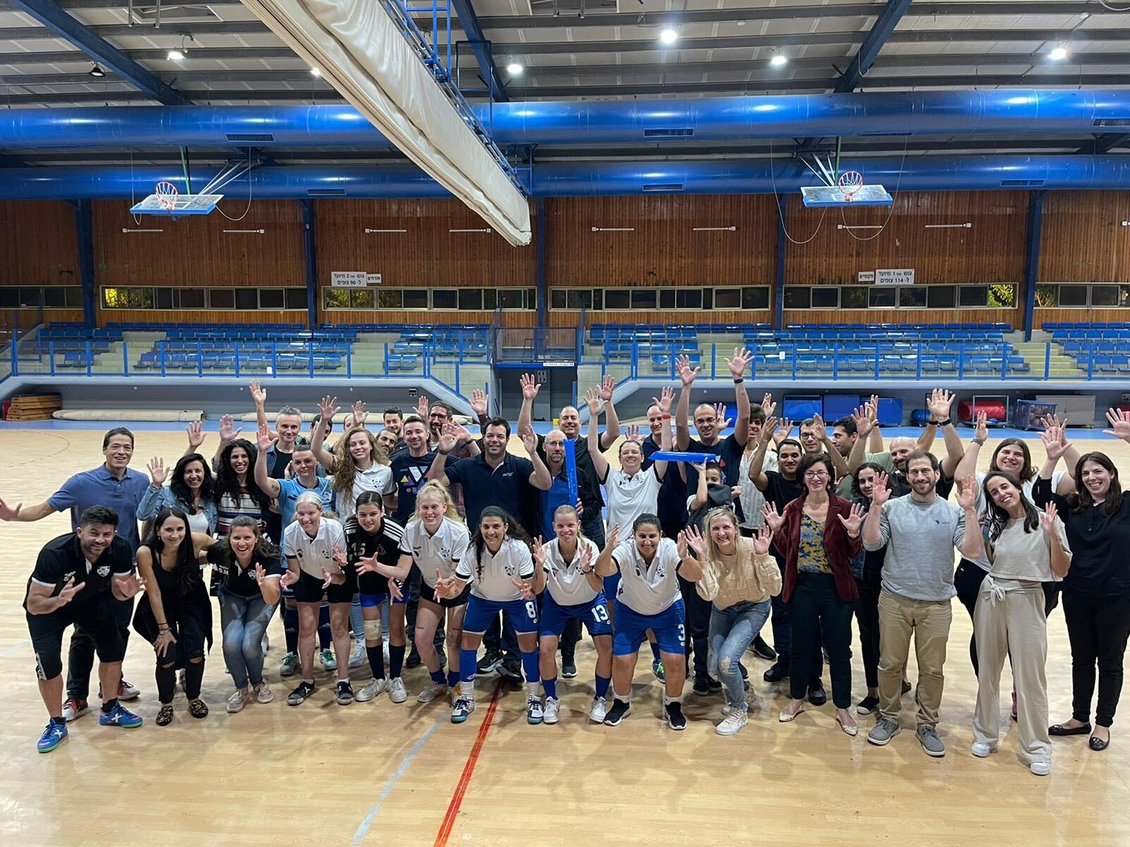Verbit employees and the Israel’s Women’s Deaf Futsal Team signing 