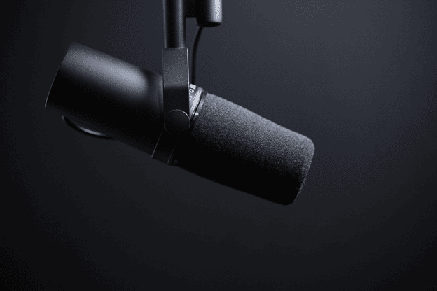 a hanging microphone with black background