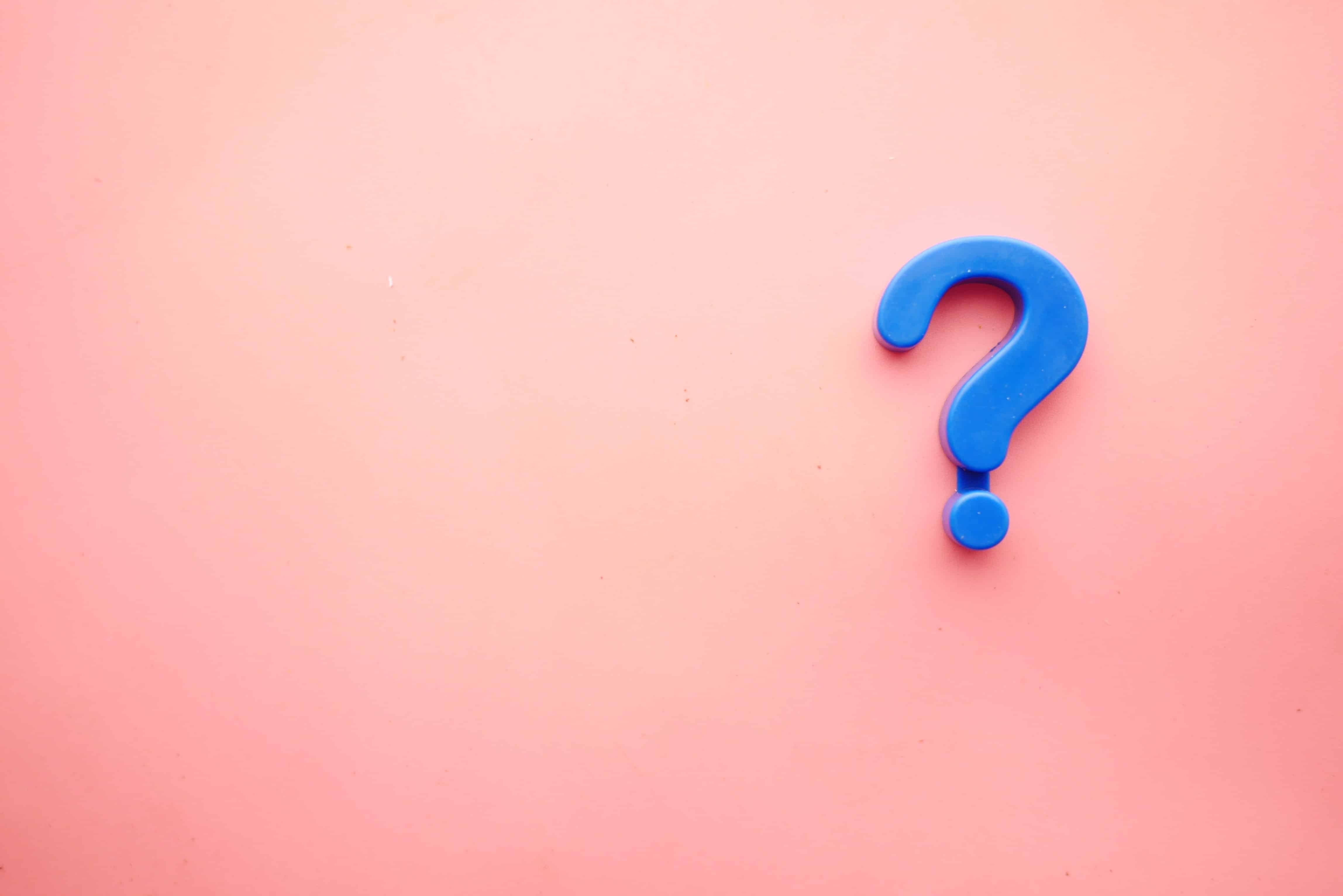 big question mark on a pink background