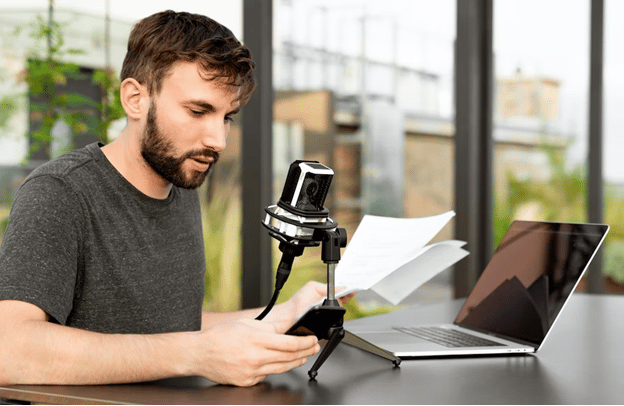 man with a microphone trying to transcribe MP3 to text