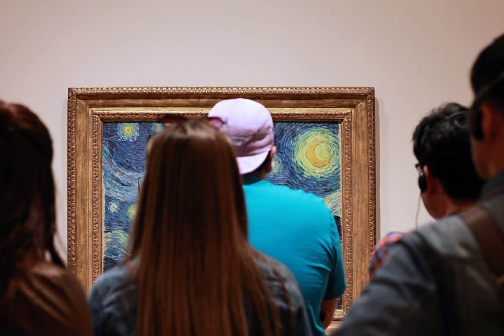 People looking at Van Gogh's Starry Night