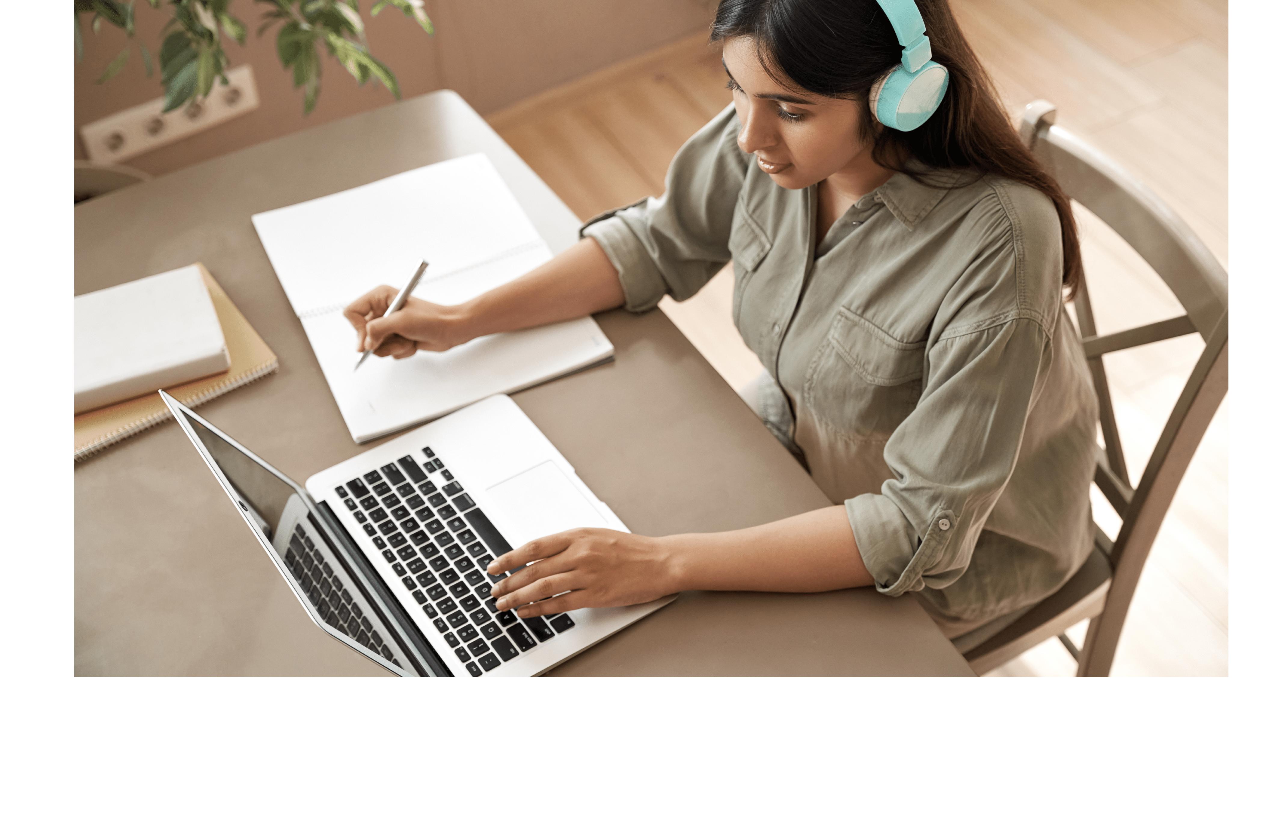 woman wearing headphones working on a computer