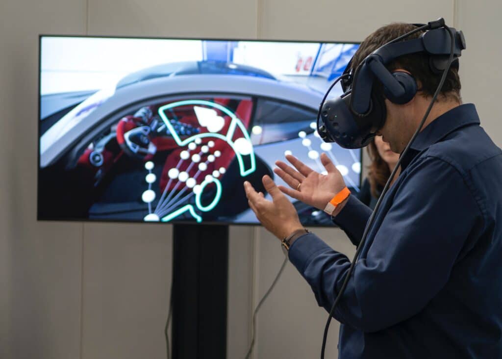 a person wearing a VR device in front of a TV