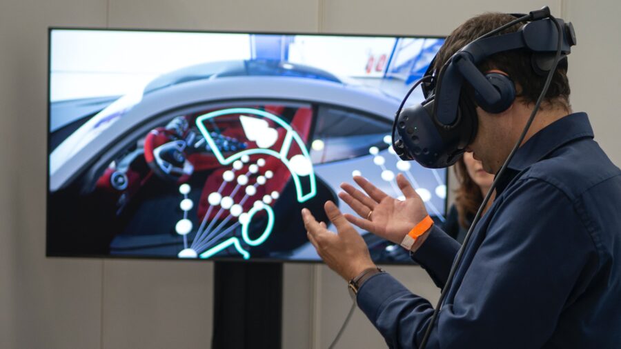 a person wearing a VR device in front of a TV