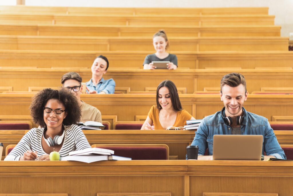 students in a lecture hall on computers