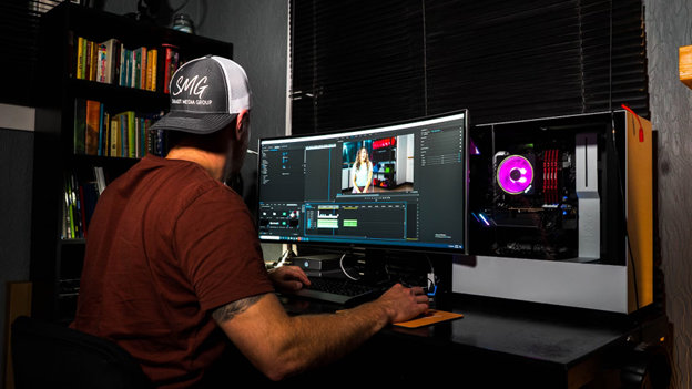 Man working on a computer with open video editing software