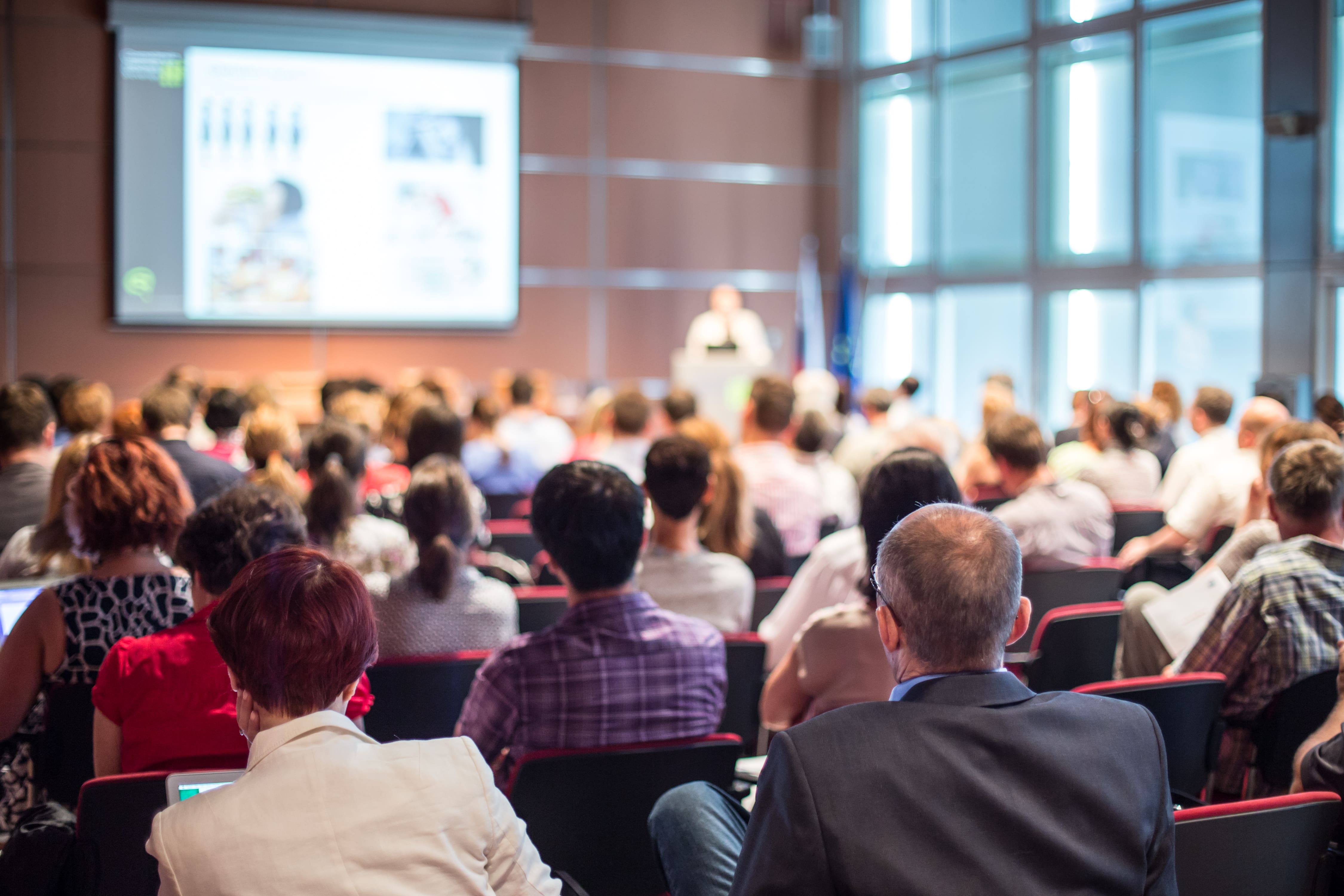 a live conference with a presenter and an audience