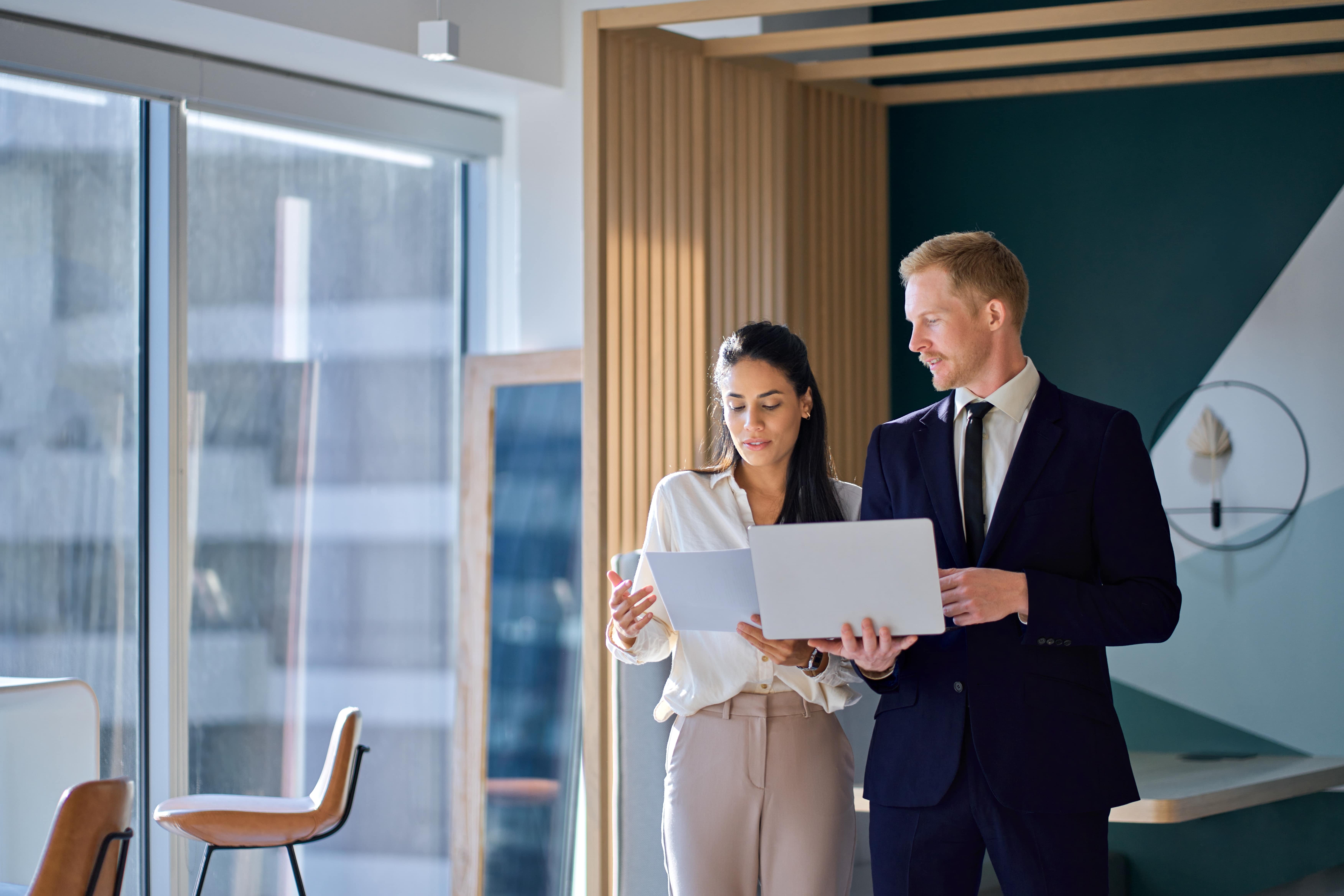 two lawyers speaking in an office