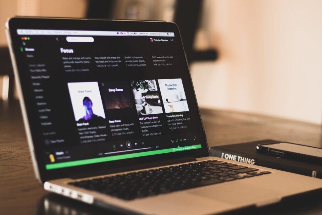 laptop displaying spotify app on screen