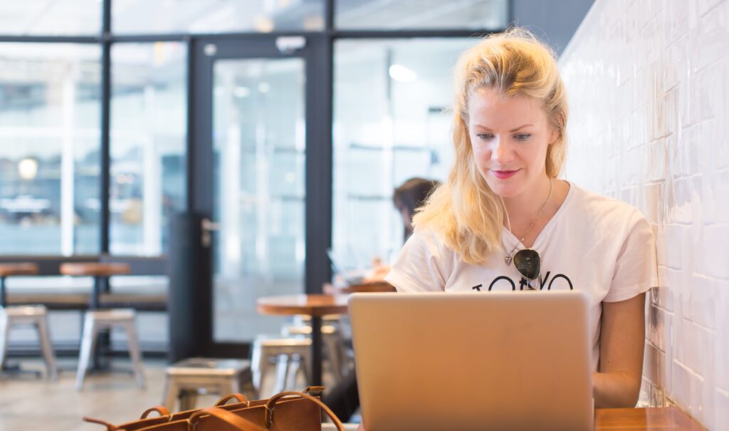 a postgraduate research student working on a computer
