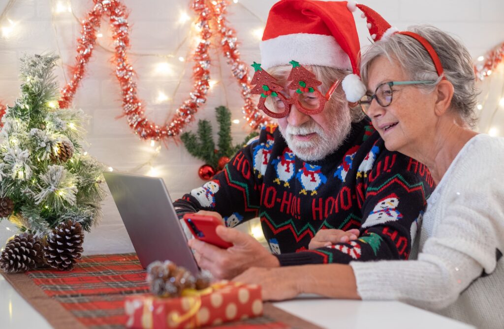 a couple doing holiday shopping online