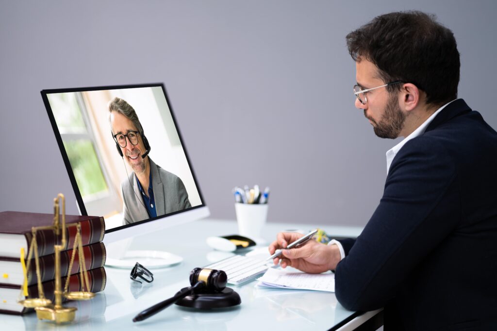 two lawyers speaking over a video call