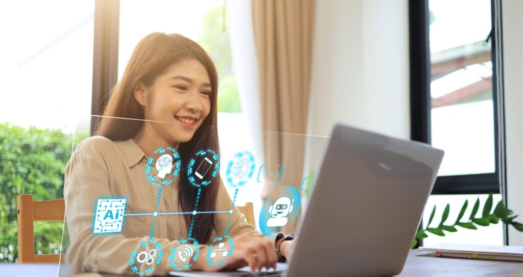 woman using a computer. Icons float above the computer including one that says "AI"