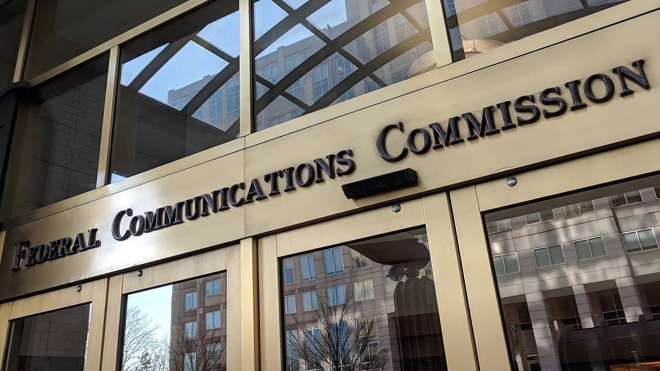 An exterior view of the doors to the Federal Communications Commission's office in Washington, D.C.