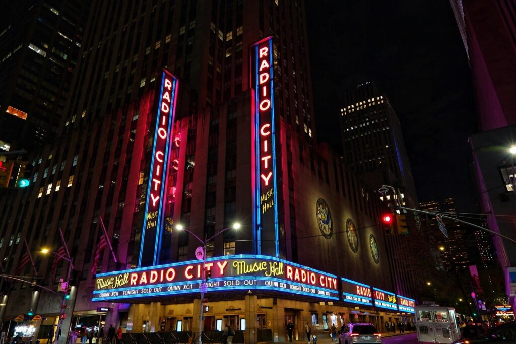Exterior view of Radio City Music Hall at night.