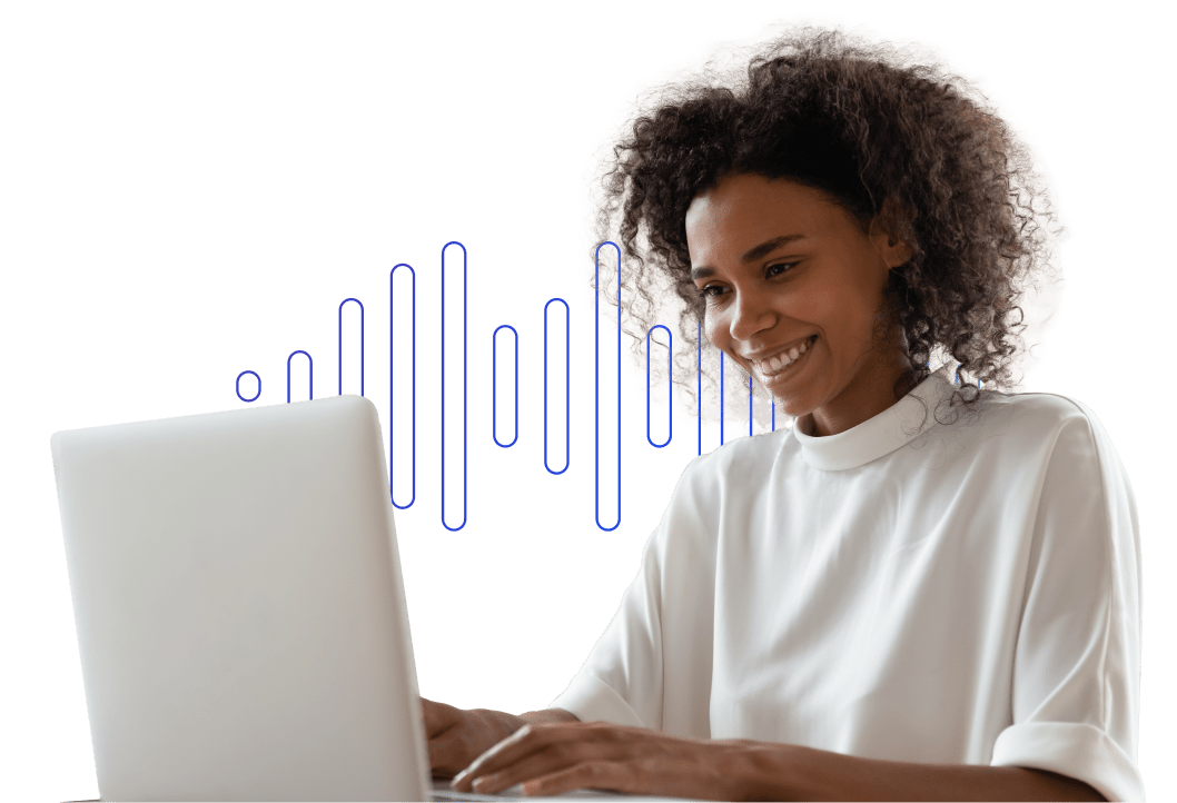 An African American woman smiles while wearing a white T-shirt and typing on a laptop.