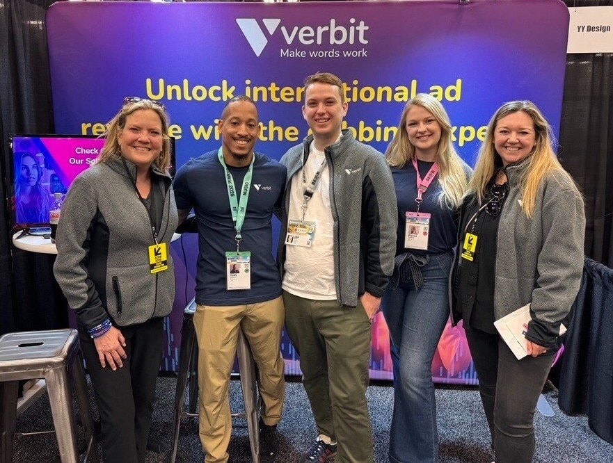 The verbit team - three woman and two men - stand in front of the verbit booth at SXSW