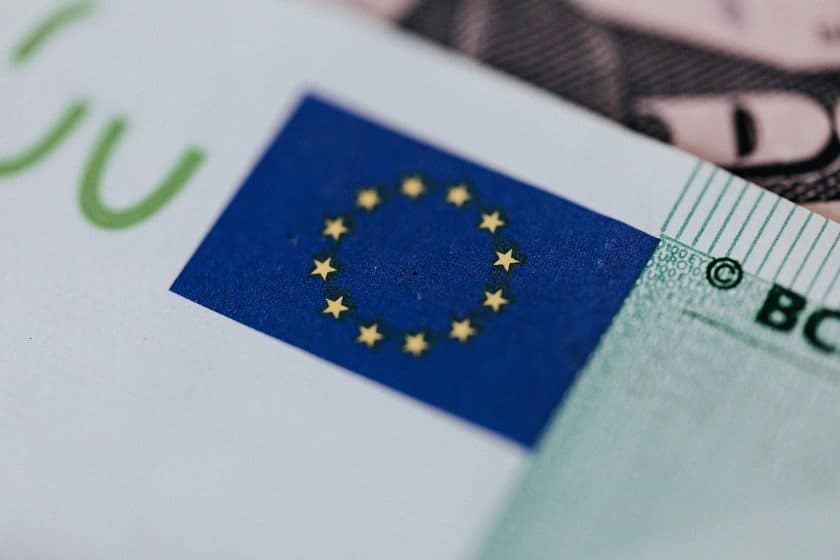 The European Union flag stamped on an envelope. The flag is dark blue with a circle of small yellow stars.