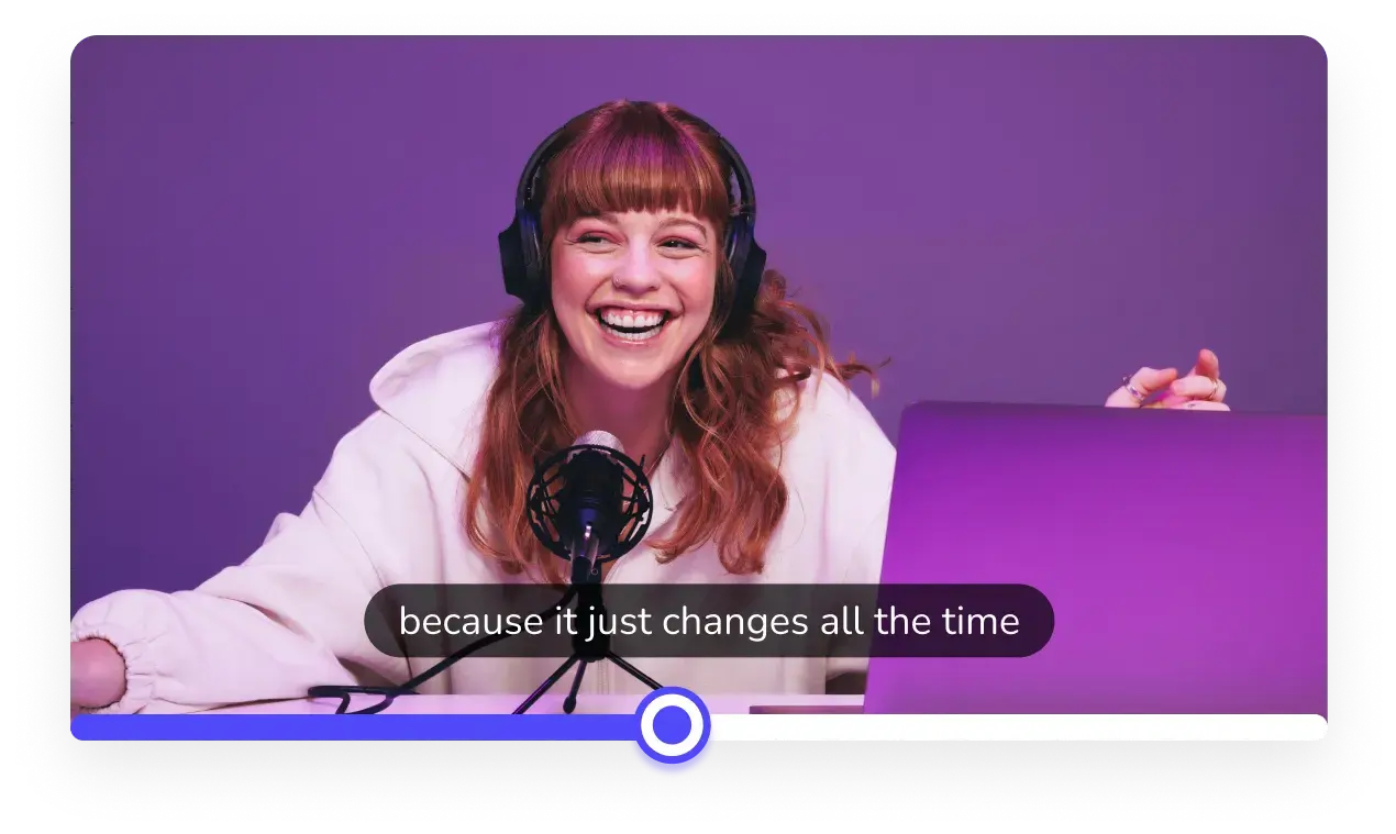 A redheaded woman is shown podcasting with a headset purple background and pink hoodie on.