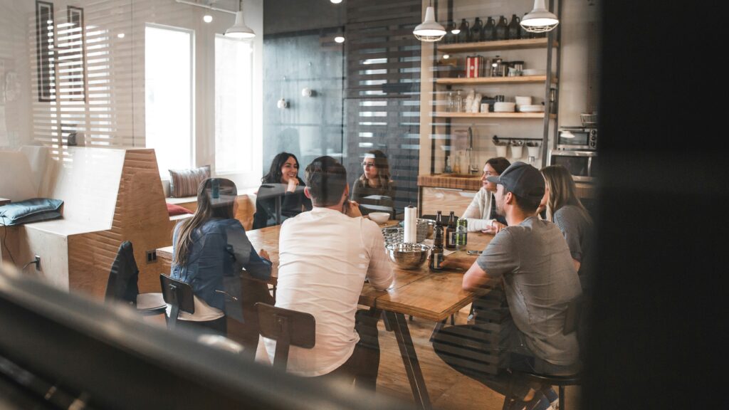 Image of professionals sitting together in an office.