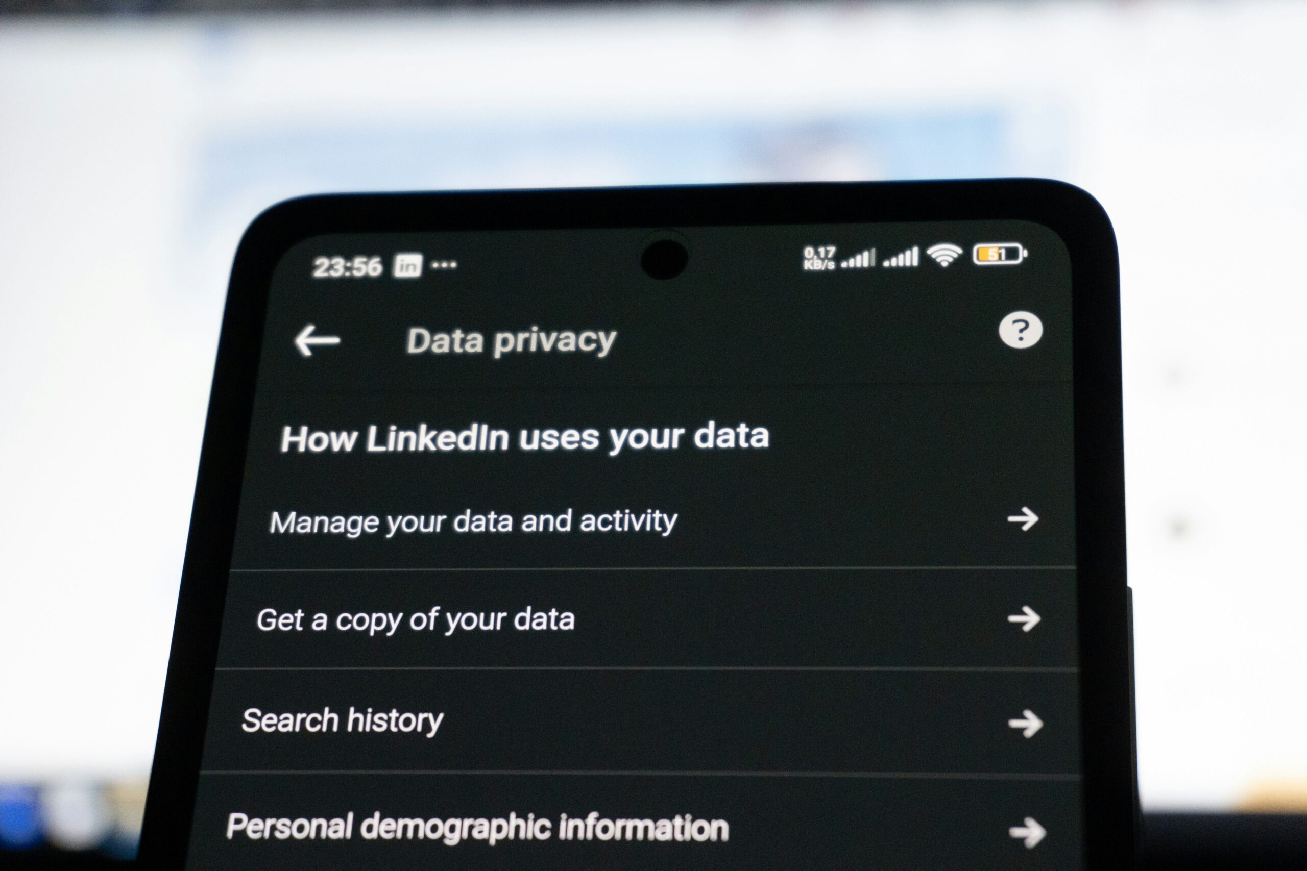 Close-up of a smartphone screen displaying LinkedIn's "Data privacy" settings menu with options such as "Manage your data and activity" and "Get a copy of your data."